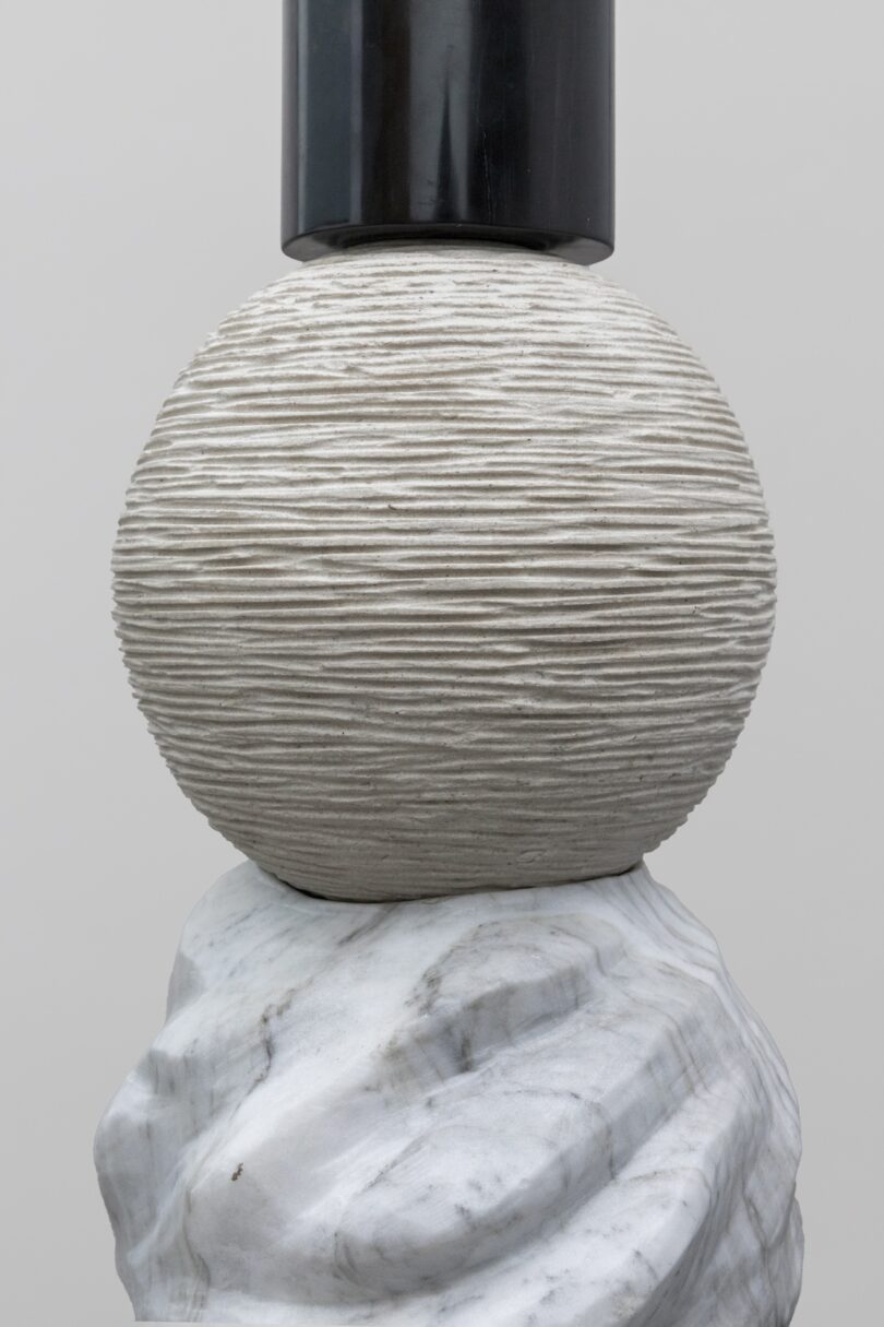 Close-up view of a sculptural piece from Sten Studio's "Cosmic Relics" collection, featuring a textured sphere made of stone