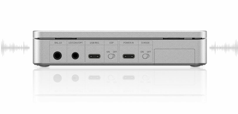 Rear view of the Fiio DM13 electronic device showing various input and output ports, including USB, power, lock, and mode switch, against a white background.