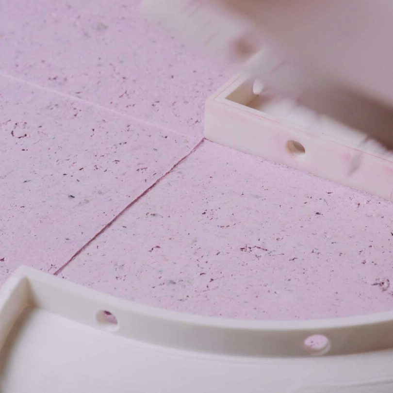 A close-up of the Pastille collection being created, pink paper material and a visible white border at the bottom and right side.