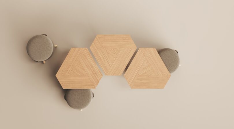 Top view of a geometric wooden table with four matching gray cushioned stools, evenly spaced around it—a design reminiscent of Frank Lloyd Wright's architectural elegance.