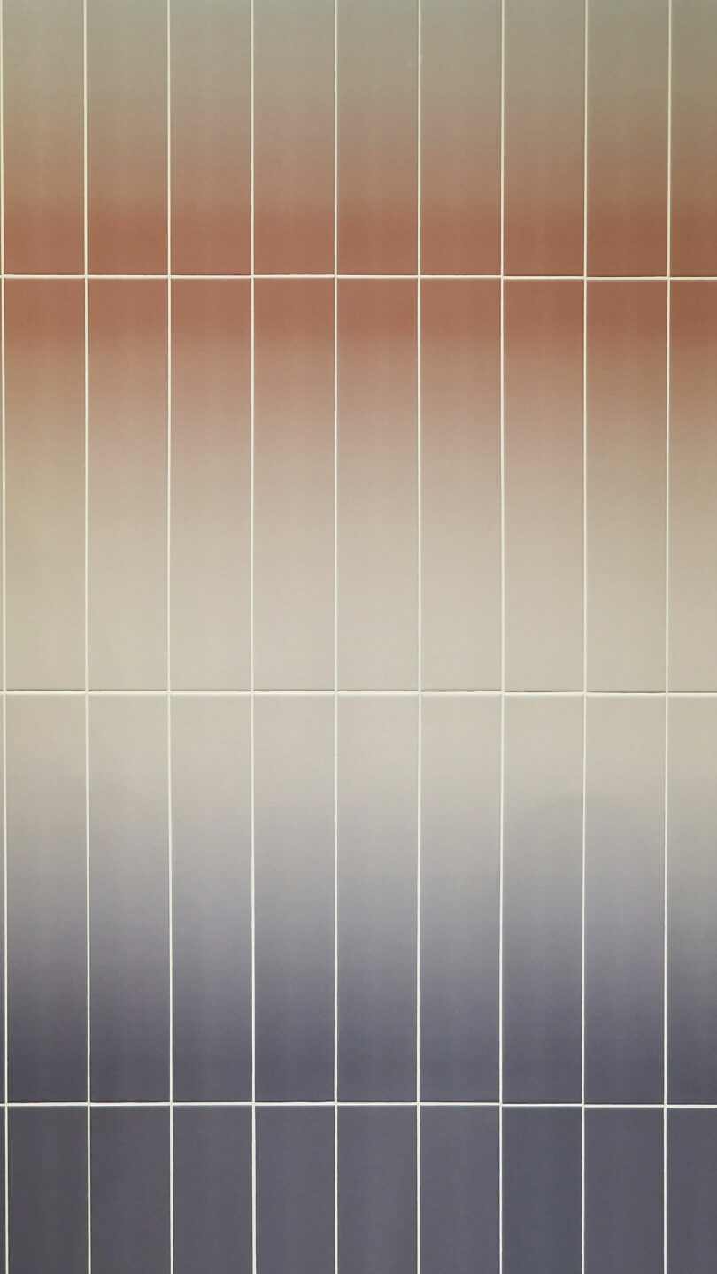 A gradient grid artwork featuring vertical and horizontal white lines over a background transitioning from warm tones at the top to cool tones at the bottom.