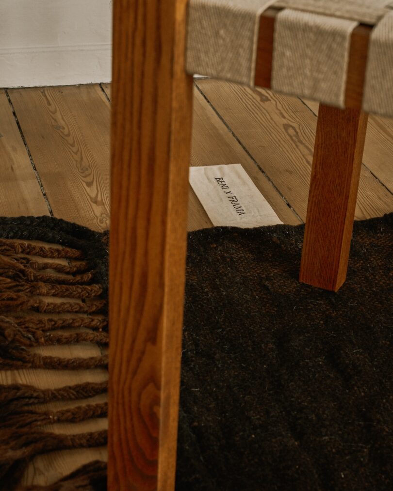 Close-up of a chair on a dark-toned Beni rug from the Terrain collection