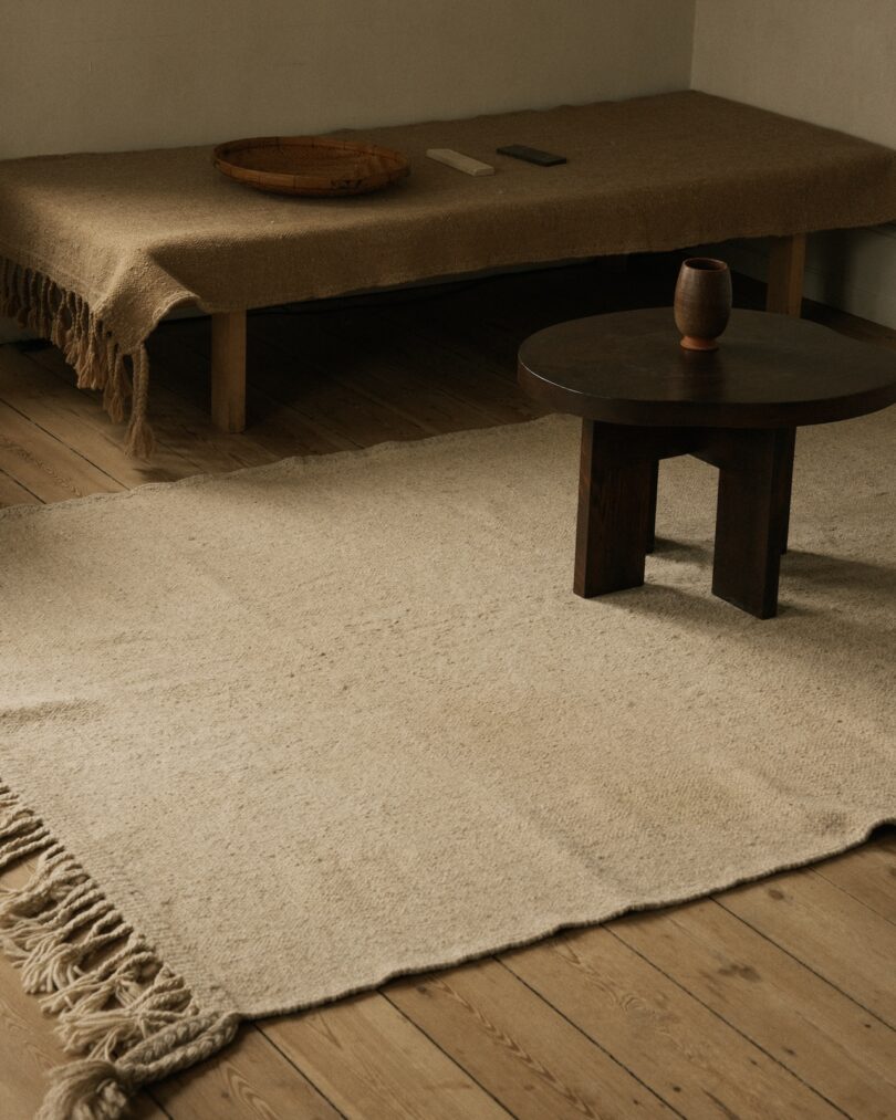 A minimalist interior featuring a Beni rug with natural wool textures