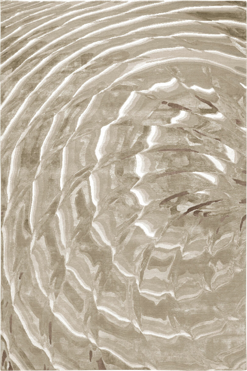 A close-up image of a brown and white pattern that resembles ripples on water, evoking the visually textured and layered effect often seen in Dale Chihuly's glass sculptures.