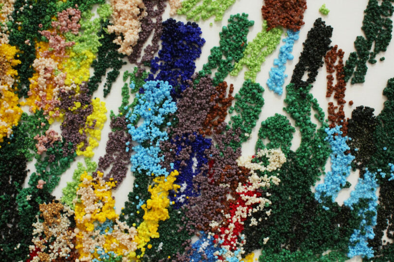 Green, Blue and Yellow beads of various sizes resemble brushstrokes