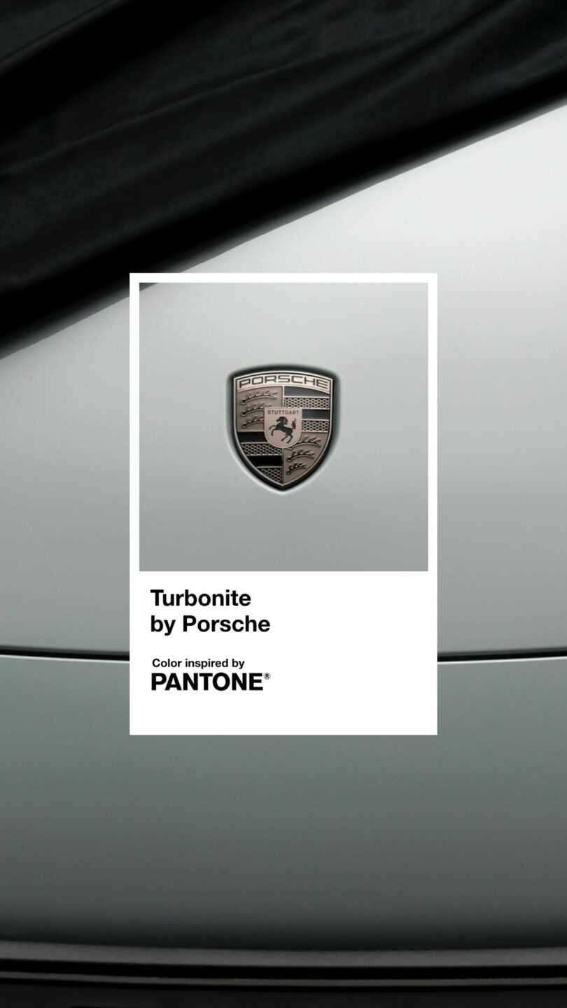 Close-up of the Porsche logo on a gray Turbonite surface labeled "Turbonite by Porsche," with a note stating the color is inspired by Pantone.