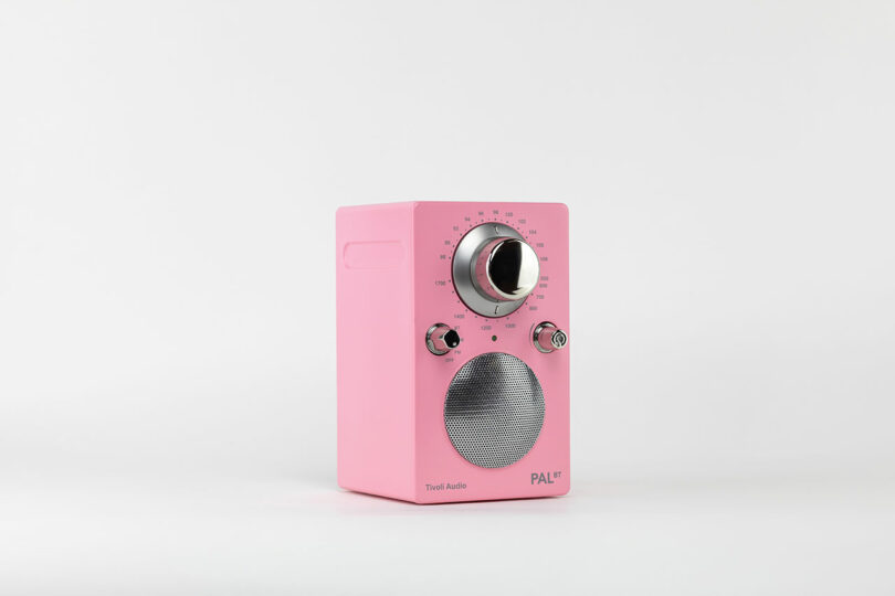 A pink portable Tivoli Audio radio with silver knobs and a speaker. The brand "Tivoli Audio" and model "PAL BT" are visible on the front. The background is plain white.