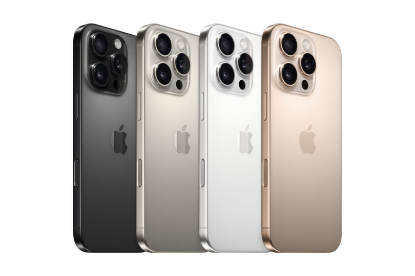 Four iPhone models are displayed in a row, showcasing colors black, silver, white, and gold. All phones feature three rear cameras and the Apple logo.