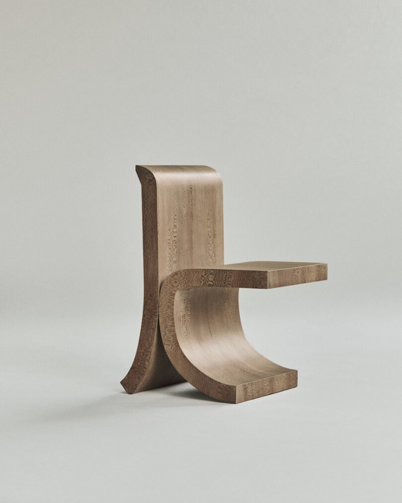 A modern, wooden chair with a unique curved design and a flat seat, set against a plain light background.