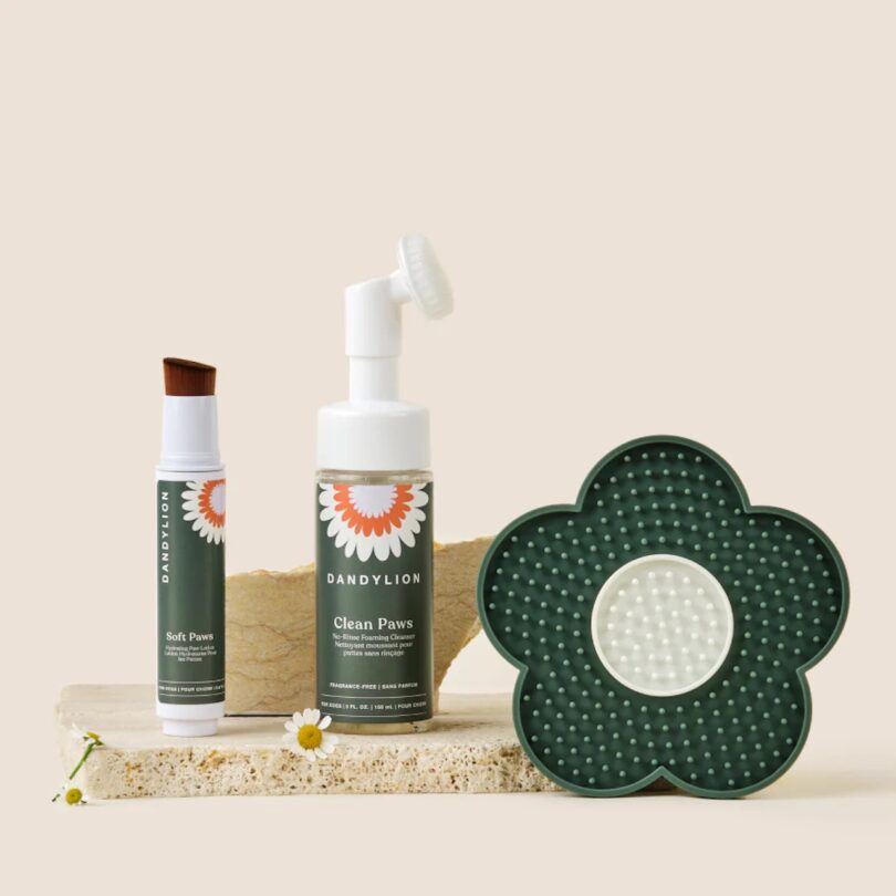 Dandylion's Easy Paw Care Kit featuring their foaming cleanser, brush-on hydrating lotion, and a green flower lick mat 