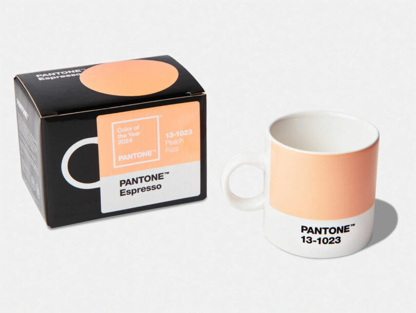 Pantone 13-1023 Peach Fuzz espresso mug next to matching box labeled Color of the Year 2024.