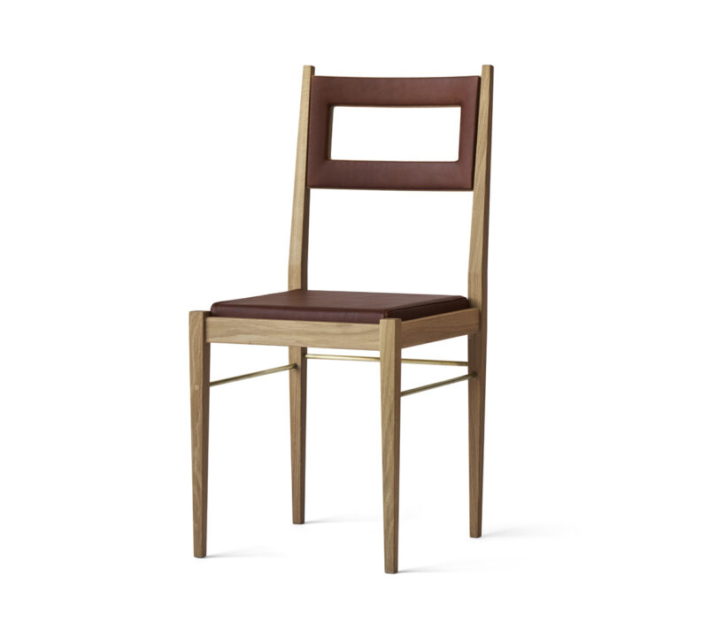 Wooden chair with a brown leather seat and backrest, featuring a rectangular cutout in the backrest.