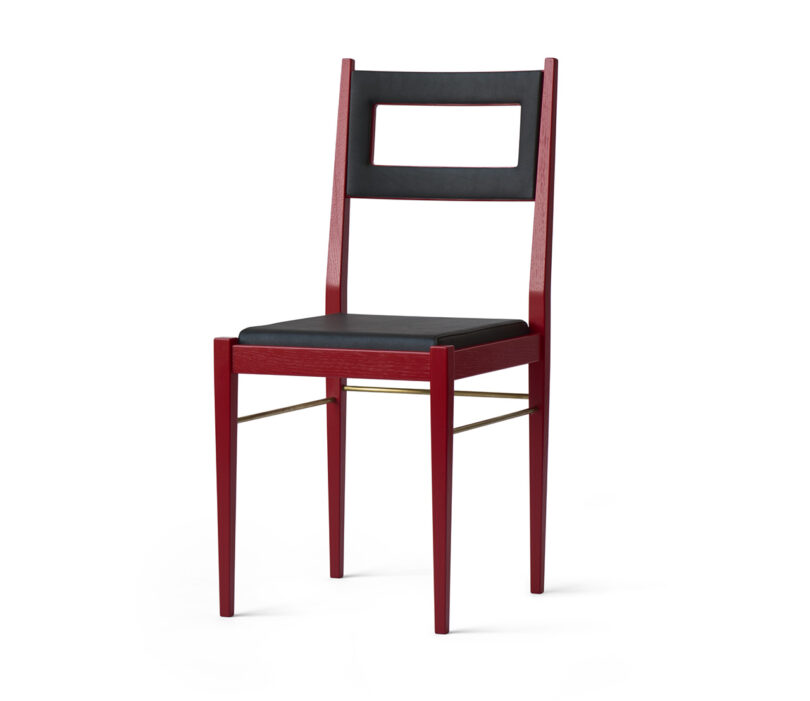 A modern chair with a dark wooden frame, featuring a rectangular backrest cutout and a black cushioned seat, stands against a plain white background.