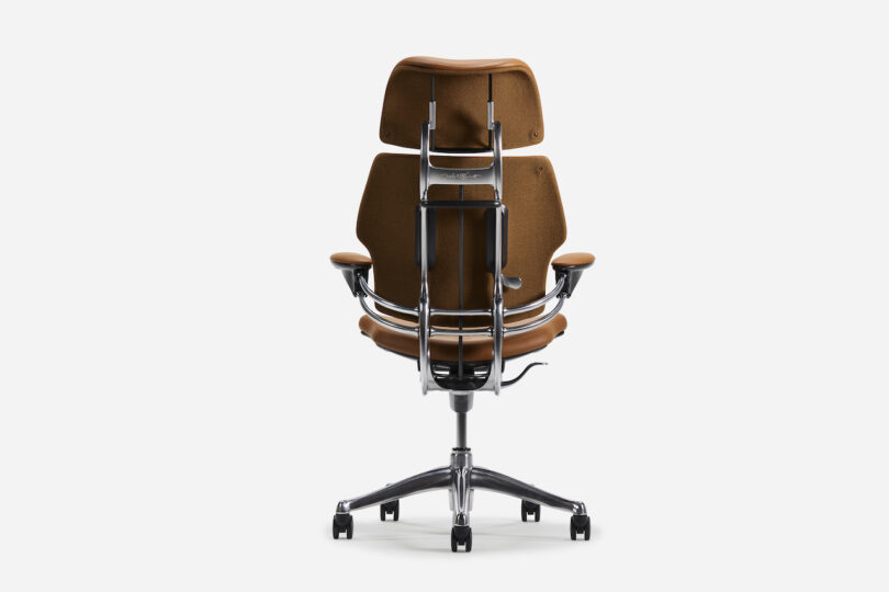 A brown swivel office chair with metal armrests and a five-wheeled base, viewed from the back