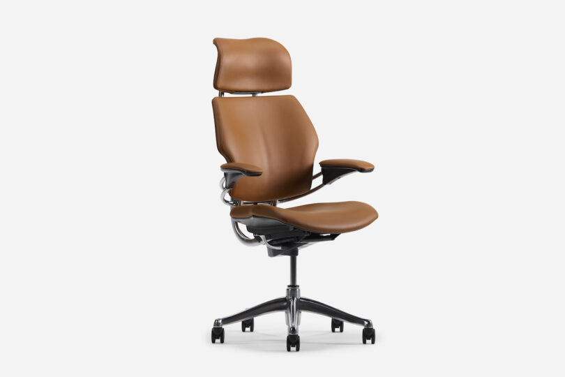 Brown ergonomic office chair with adjustable armrests, headrest, and black wheeled base on a white background