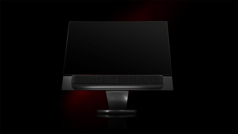 A sleek, black monitor with a thin bezel and a central stand, exuding the same elegance and precision as a Ferrari, set against a dark background.