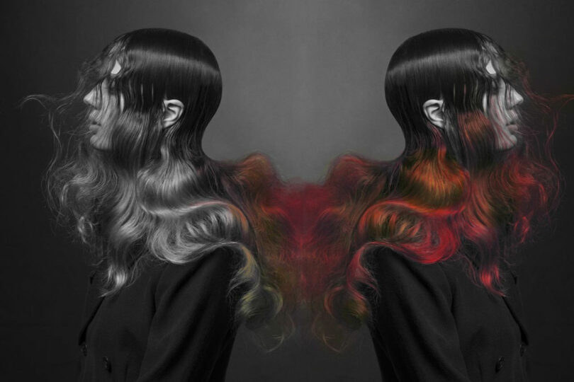 Two mirrored figures with long, flowing hair in black and red tones, reminiscent of Anya Molyviatis's style, grace a dark background.