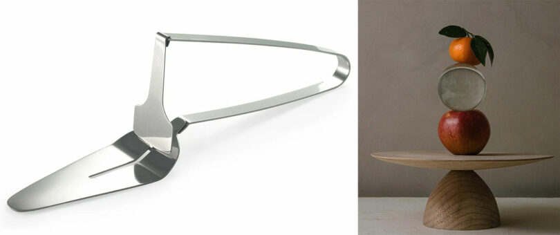 On the left, a silver cake server. On the right, a wooden stand with a balanced glass sphere, apple, and orange.