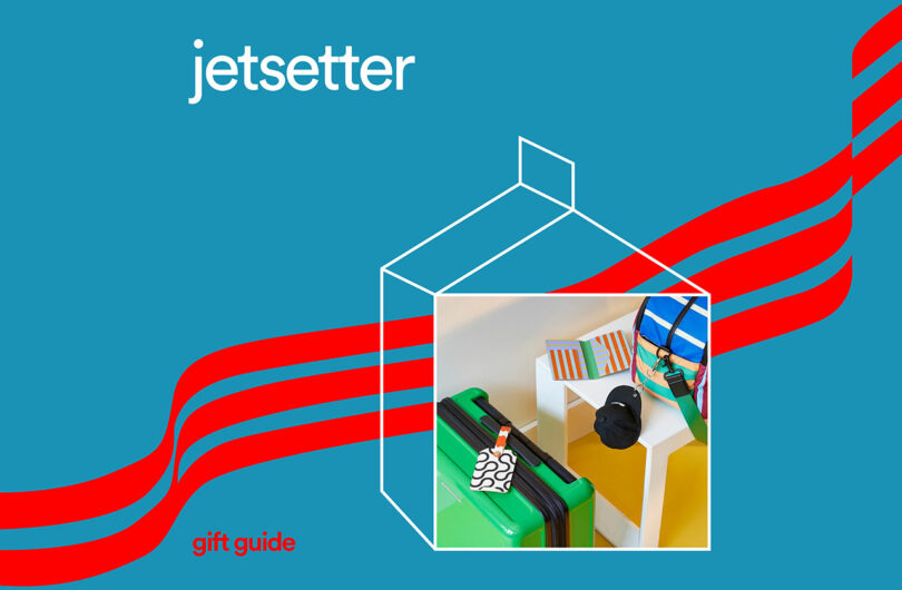 Blue background with "jetsetter" text. Inside an outlined square, a luggage, camera, passport, and bag are displayed on a table. Red diagonal lines cross the image. The phrase "gift guides" is prominently featured in the corner.