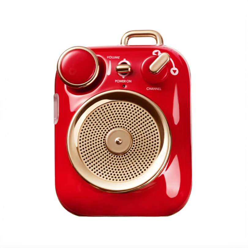 A red and gold retro-style radio with volume and power controls on a white background.