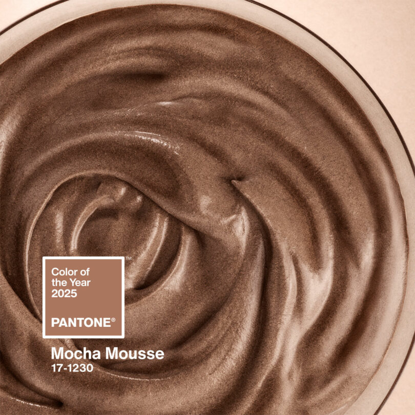 Close-up of a luscious mocha mousse swirl, exuding rich, earthy tones. The text "Color of the Year 2025 PANTONE Mocha Mousse 17-1230" elegantly overlays the delectable image.