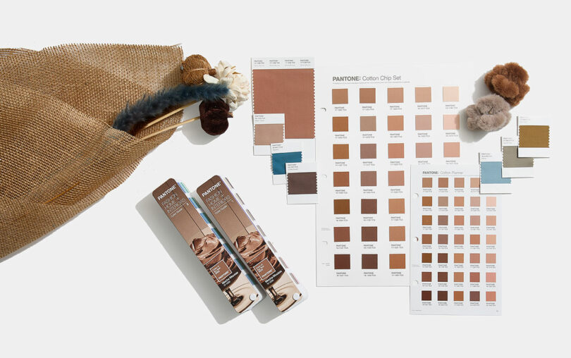 Pantone cotton chip set featuring "Mocha Mousse" color sample sheets elegantly arranged with fabric swatches on a crisp white background, all presented in stylish brown packaging.