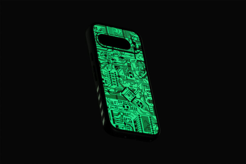 A phone case with a glowing circuit board design against a dark background.