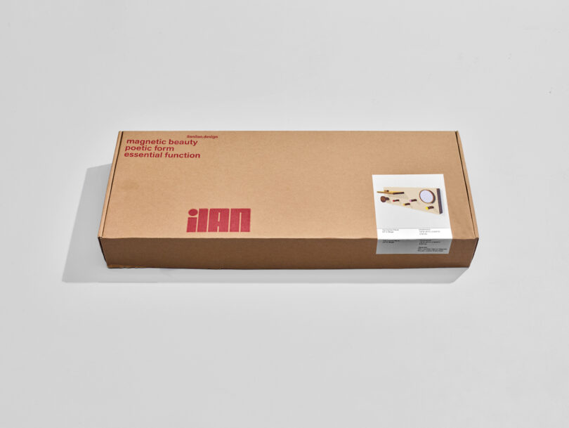 A brown cardboard box with "ilan" printed in red. A small photo of kitchen utensils is on the box's upper right corner