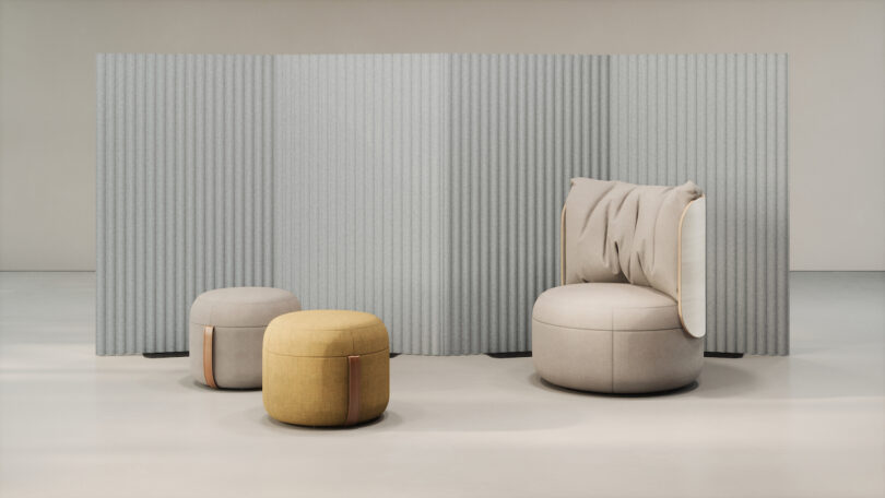 Modern seating area with a gray privacy screen, featuring a beige chair and two ottomans, one gray and one yellow, on a light floor