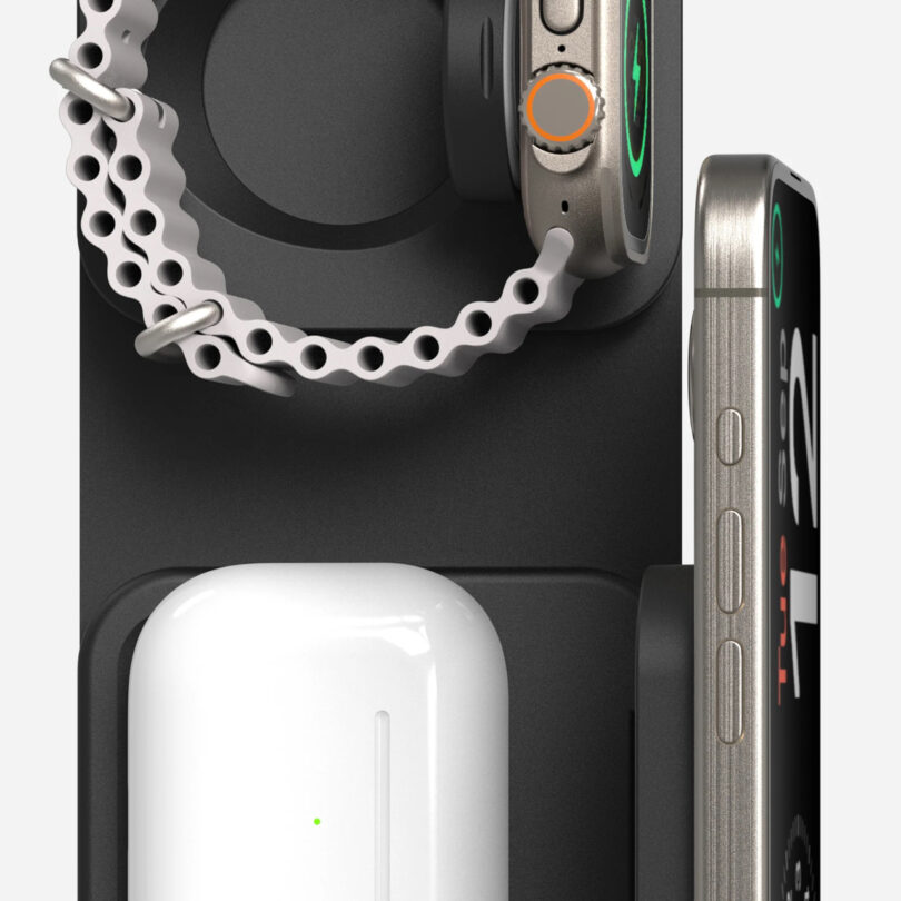 Multi-device charging station with a smartwatch, smartphone, and wireless earbud case placed on it.