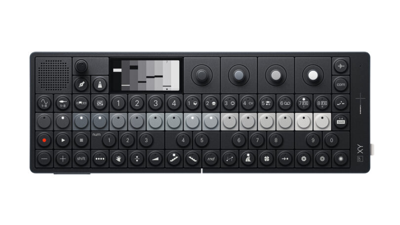 A compact, black electronic synthesizer with a variety of buttons, knobs, and a small display screen.