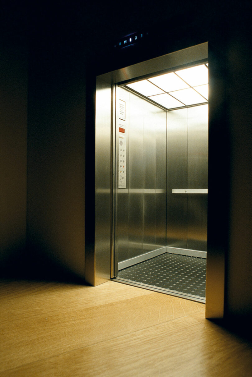 Tiny elevator opens in dark room