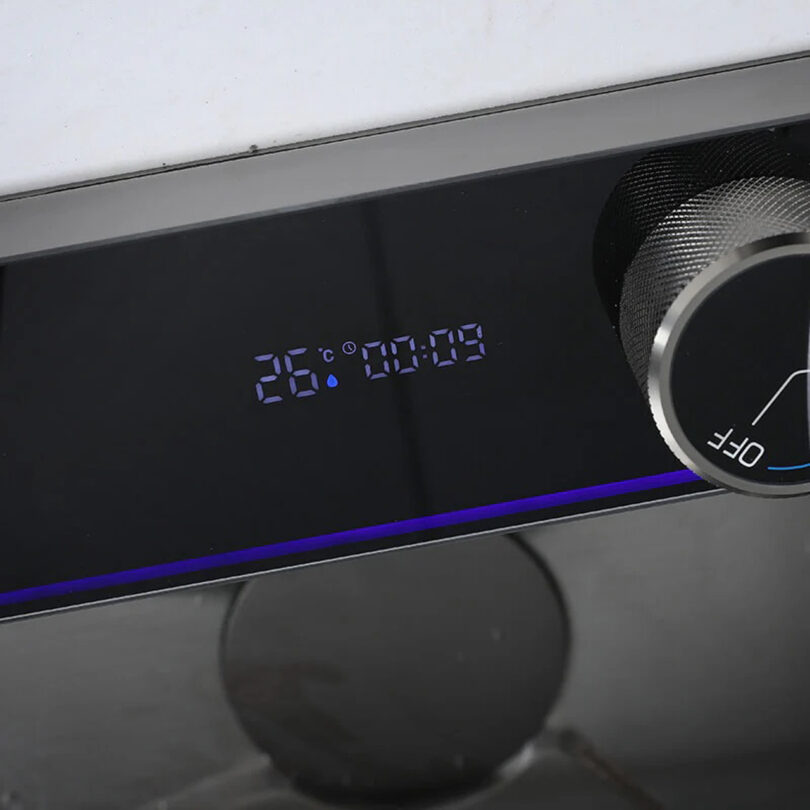 Close-up of a digital display showing "26°C" and a timer "00:09," with an adjacent large knob labeled "OFF.