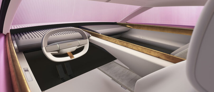 Futuristic car interior with a minimalist design, featuring a rectangular steering wheel and gold accents. The dashboard and seats are sleek and modern.