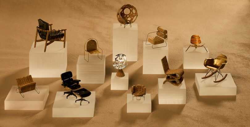 Miniature chairs and decorative objects displayed on white platforms, set against a beige background.