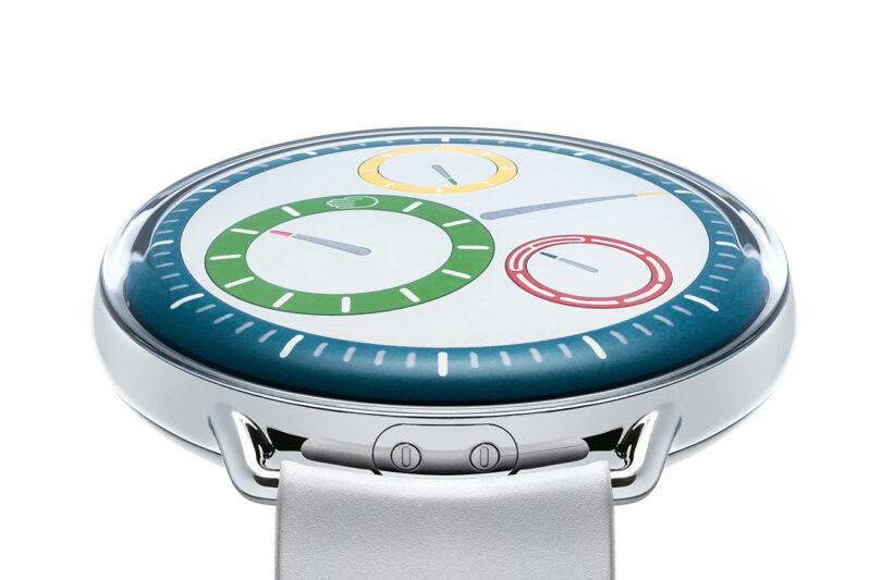 A round smartwatch with a minimalist digital display showing various circular graphs and white strap.