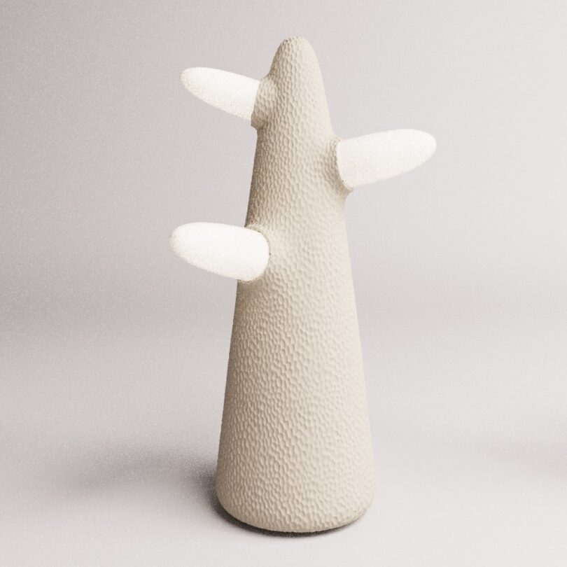 A textured, cone-shaped lamp with three protruding arms on a plain background