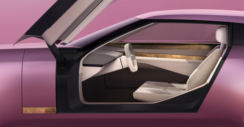 Futuristic vehicle interior with an open door. Features a minimalist design with neutral-colored seats and dashboard, set against a pink exterior.