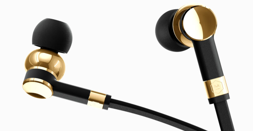 Black and gold in-ear headphones with a sleek design and earbud tips.