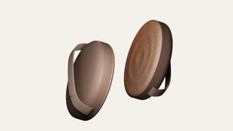 Two modern, brown oval-shaped stools with handles are shown at different angles against a plain background.