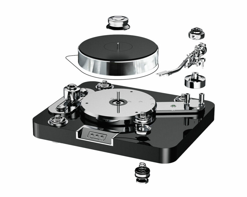 Exploded view of the Signature 12.2 turntable reveals disassembled components, including a base, platter, tonearm, and screws, all against a pristine white background.