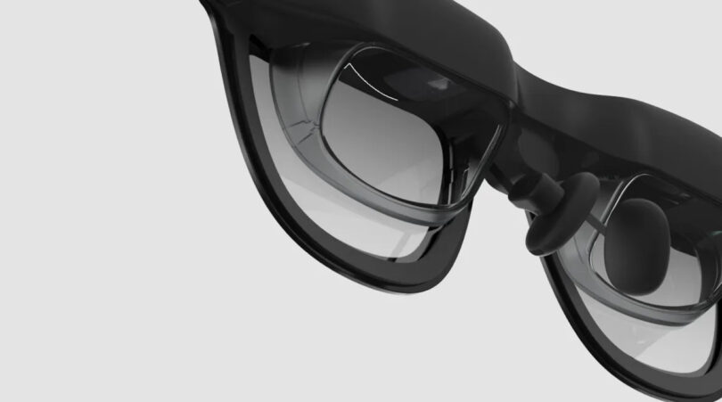 Xreal One smart glasses display technology on a white background.