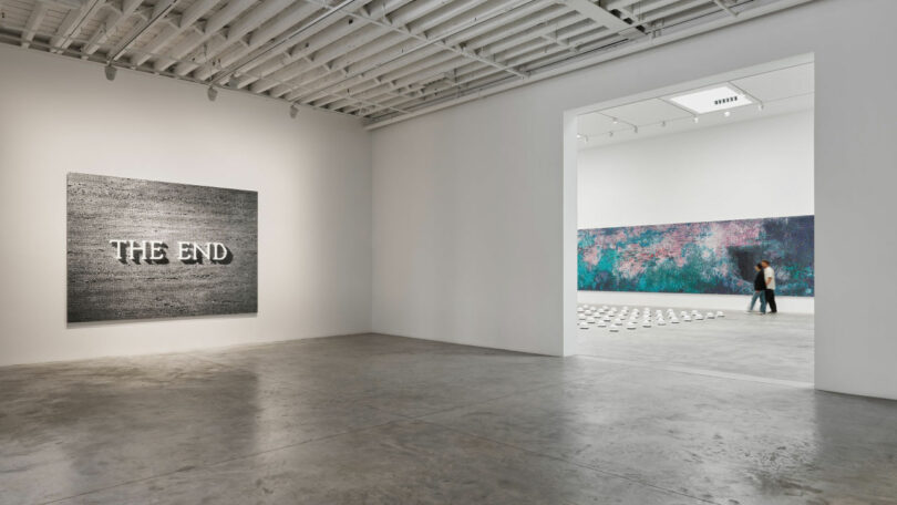 Entrance of gallery displaying a text-based work reading "The End"