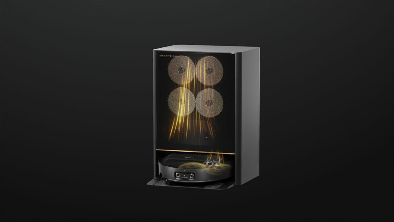 Behold the Dreame X50, a digital rendering of a sleek black automatic coffee machine. It features a transparent front panel showcasing coffee beans inside and a sophisticated control panel at the bottom, merging style with functionality in one exquisite appliance.