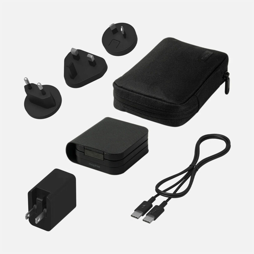 The Mophie travel charger kit includes various international plug adapters, a charging block, USB-C cable, and a zippered carrying case.