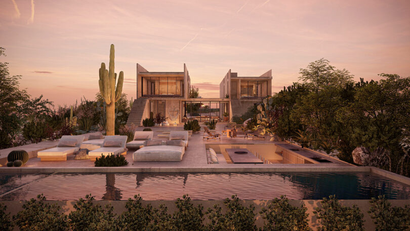 Modern house with large windows, surrounded by desert plants, features a spacious patio with seating and a pool. The sky has a pink hue, suggesting sunset or sunrise.