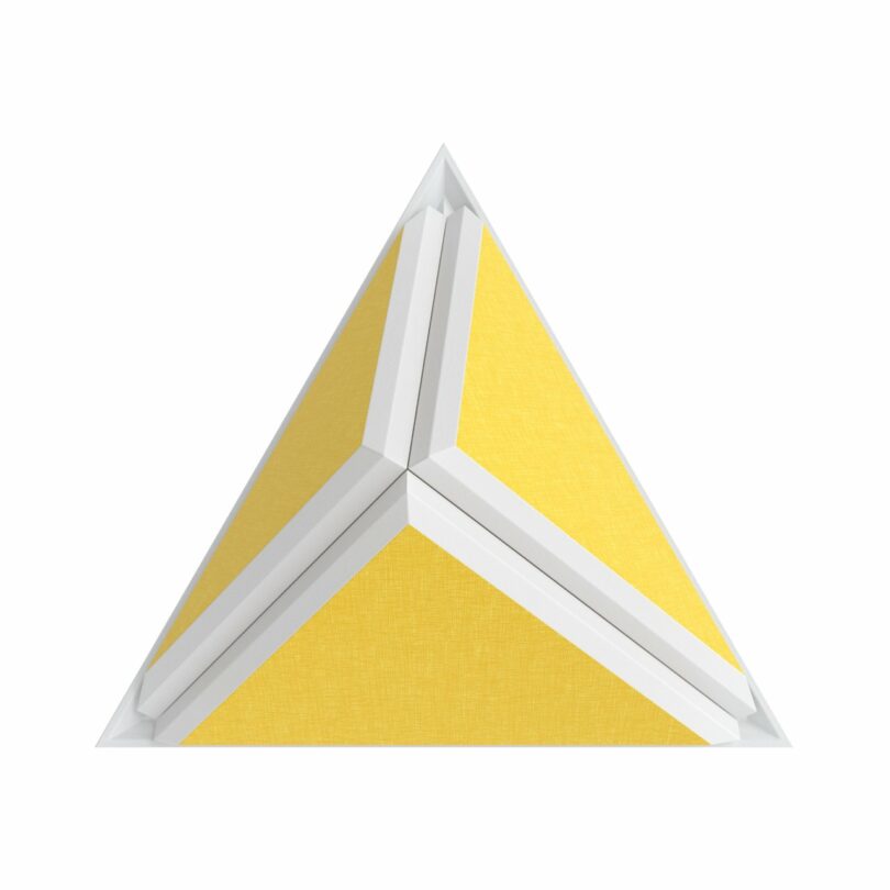 Yellow and white geometric pyramid with a triangular base, featuring interlocking segments.