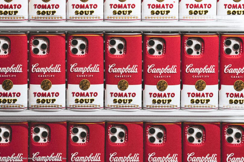 Rows of Campbell's Tomato Soup cans merged with iPhone camera lenses in a repeating pattern.