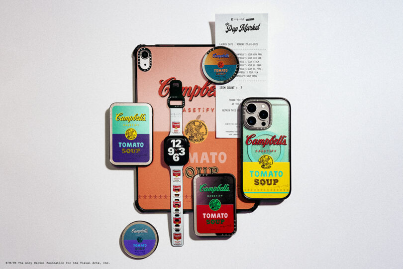 Collection of tech accessories and a receipt, all featuring Campbell's Tomato Soup designs, including a phone case, tablet case, watch, and several pins.