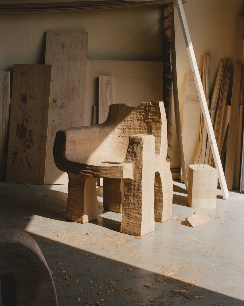 Wooden chair with an irregular, natural shape in a workshop. 